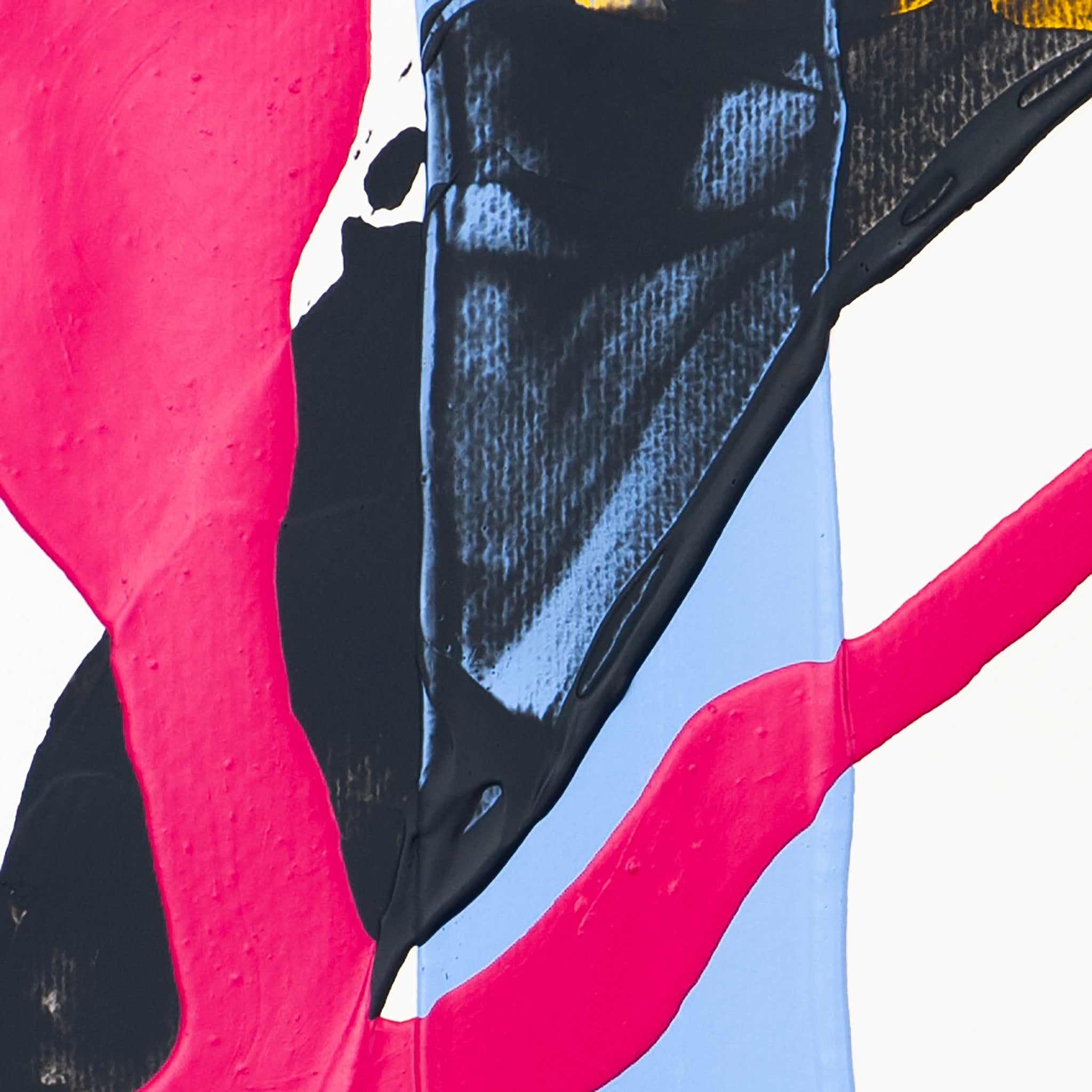 Close-up of abstract artwork with thick pink brushstroke over black and blue acrylic paint on paper