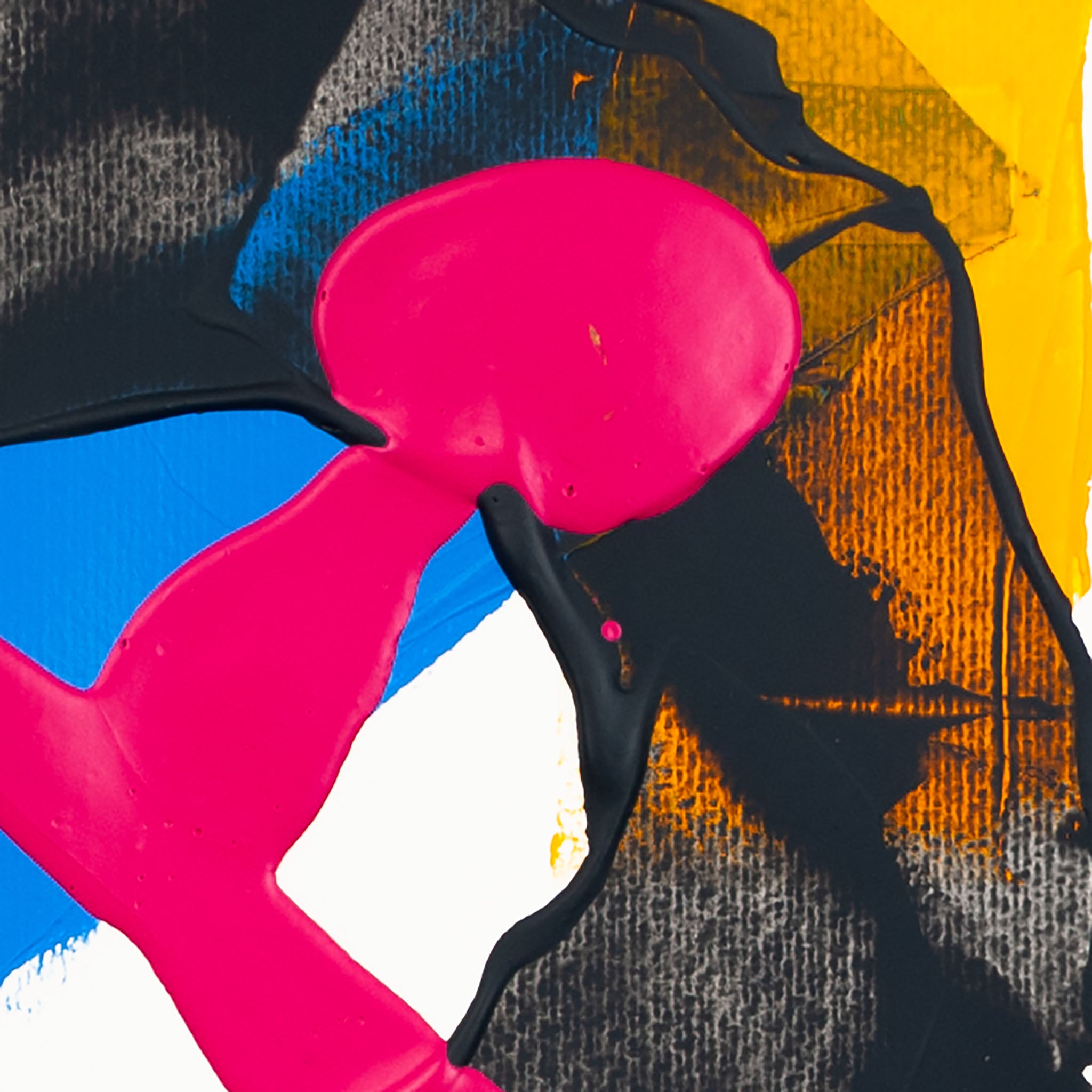 Close-up of matte pink acrylic paint intersecting dark grey textured forms with yellow and blue sections on white paper.