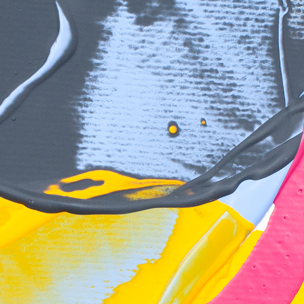 Abstract close-up of colorful paint or ink textures with gray, white, yellow, pink, and black areas.
