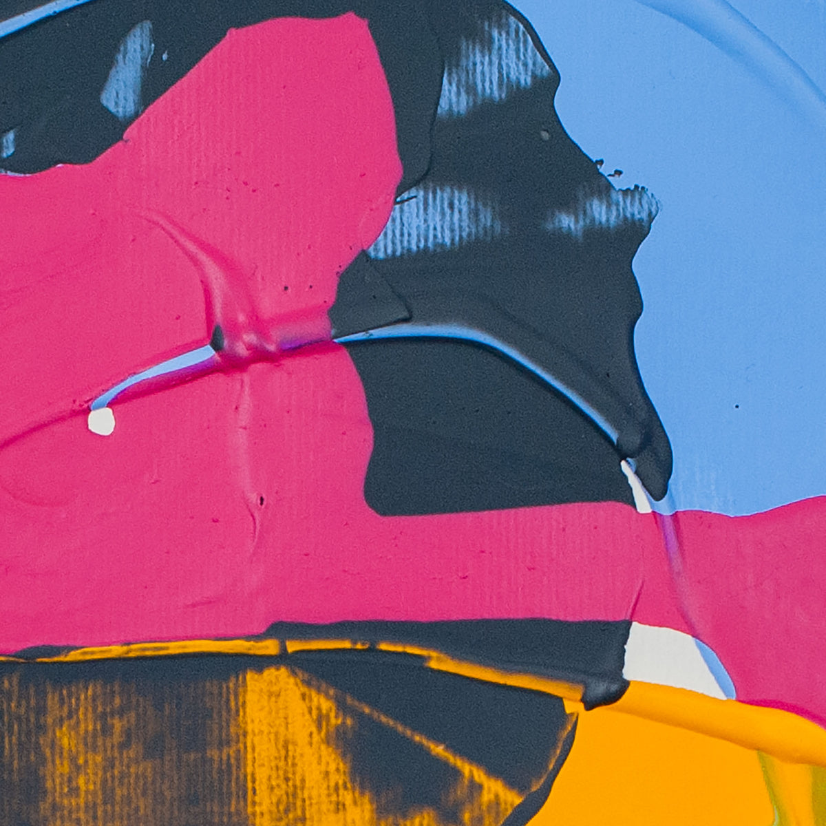 Abstract close-up of a painted surface with bold blocks of pink, black, blue, yellow, and small white areas.