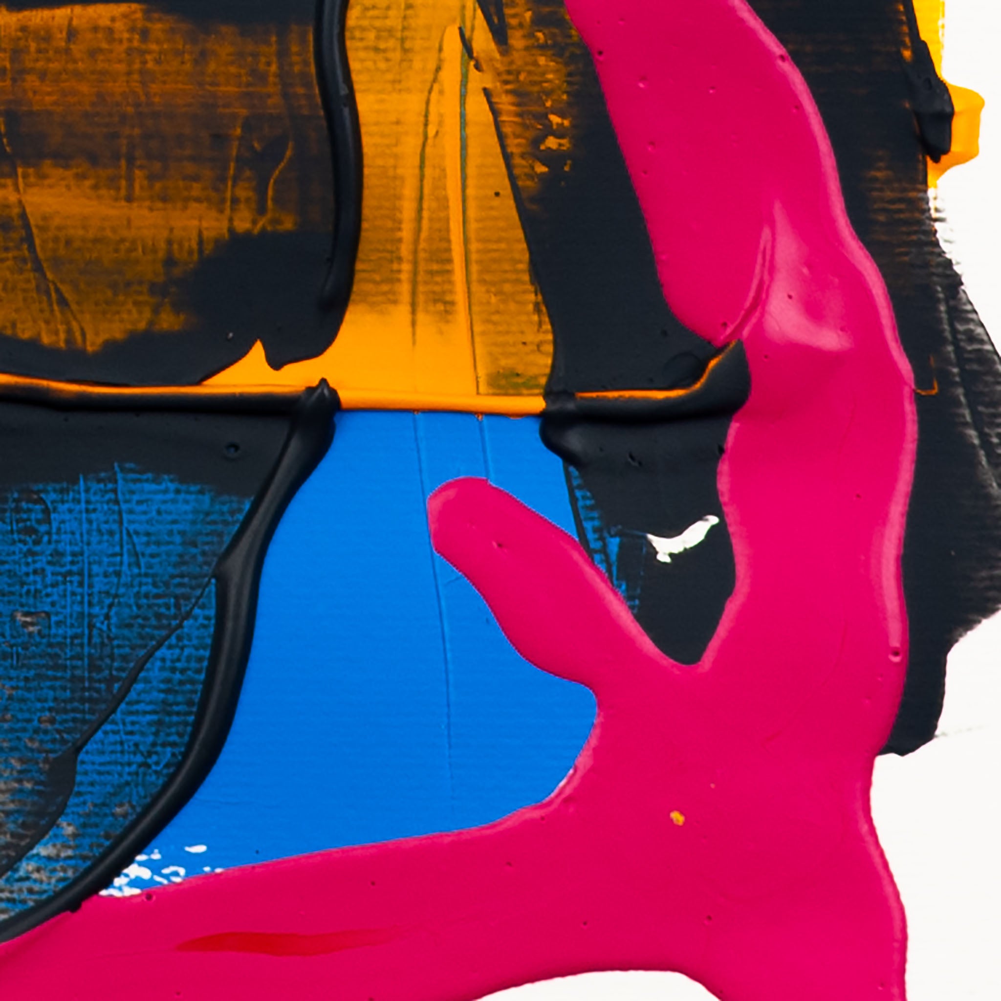 Close-up of matte pink acrylic paint layered over black textured forms with blue and yellow sections on white paper.