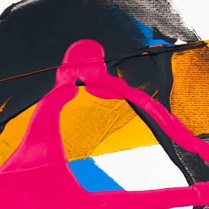 Close-up of matte pink acrylic paint layered over dark grey textured forms with yellow and blue sections on white paper.