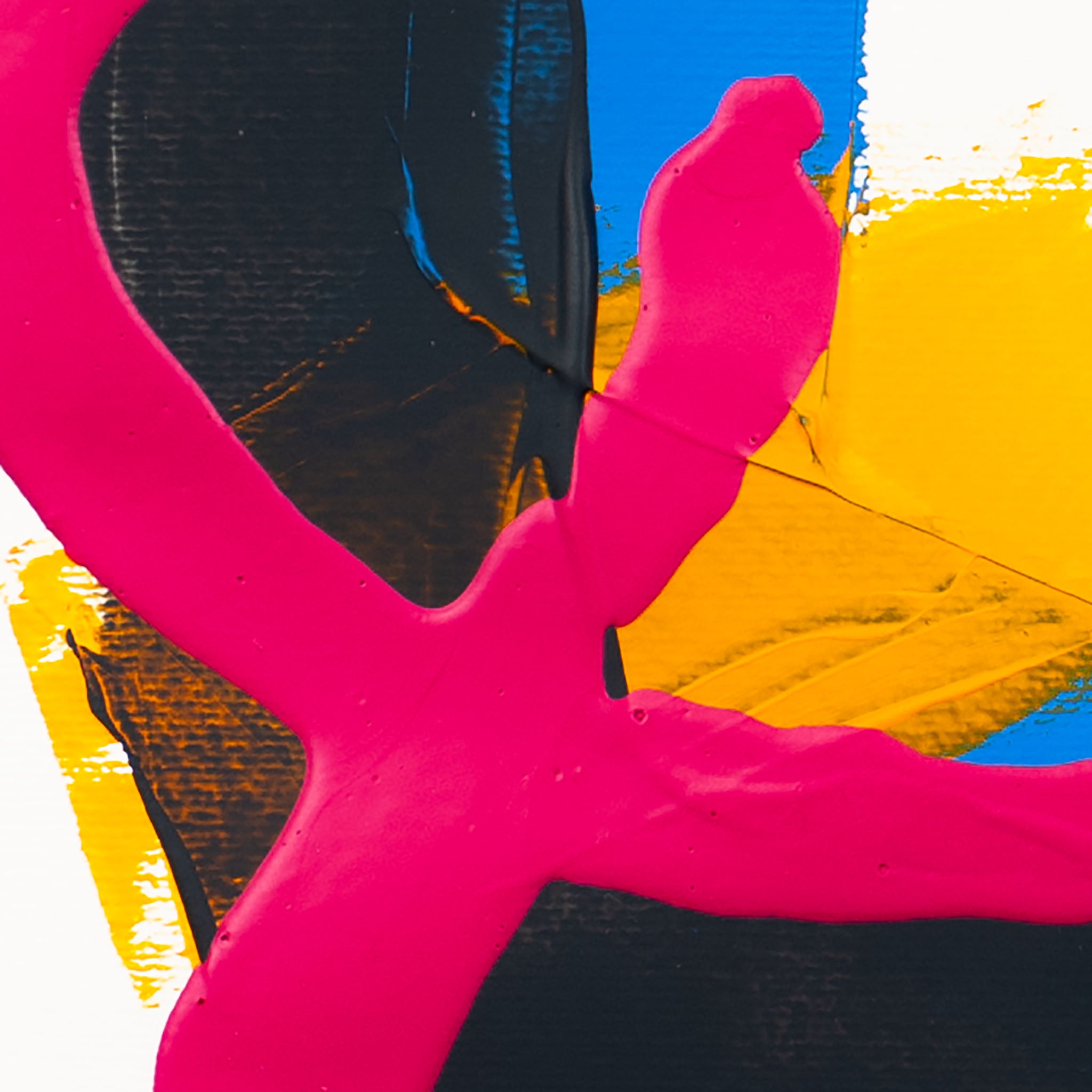 Close-up of matte pink acrylic paint intersecting dark grey textured forms with yellow and blue sections on white paper.