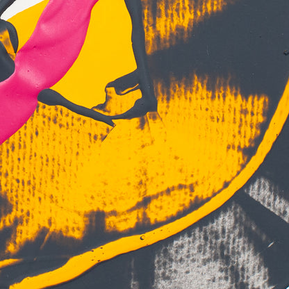 Abstract graphic print featuring bold yellow, hot pink, black, and gray shapes with a textured, distressed aesthetic.