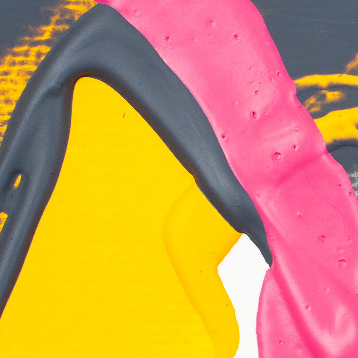 Abstract close-up of thick paint with bright yellow, vivid pink, and dark charcoal/black strokes on a white background.