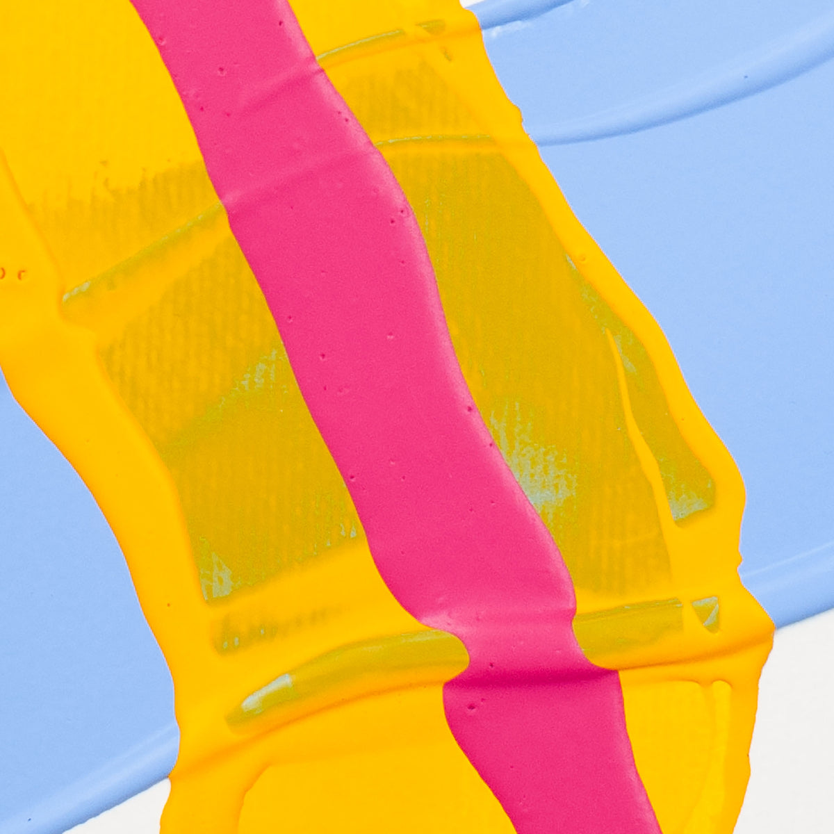 A close-up of a textured surface featuring bold vertical stripes of bright yellow, vivid pink, and light blue paint.