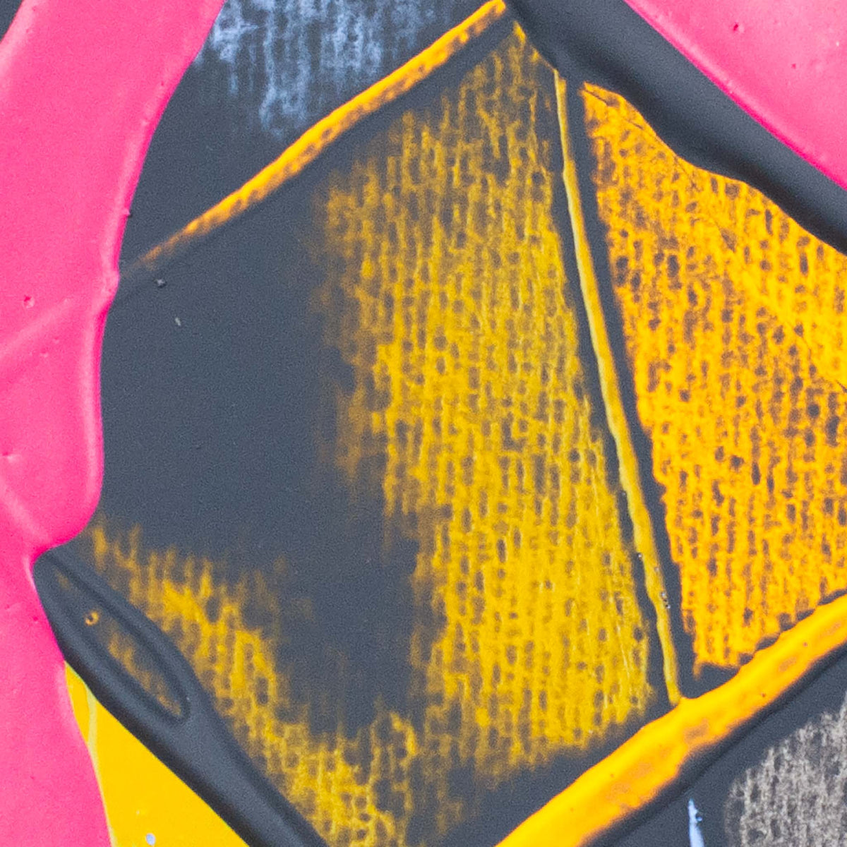 A close-up of a colorful abstract pattern featuring textured yellow and black sections framed by bright pink and dark gray curved shapes.
