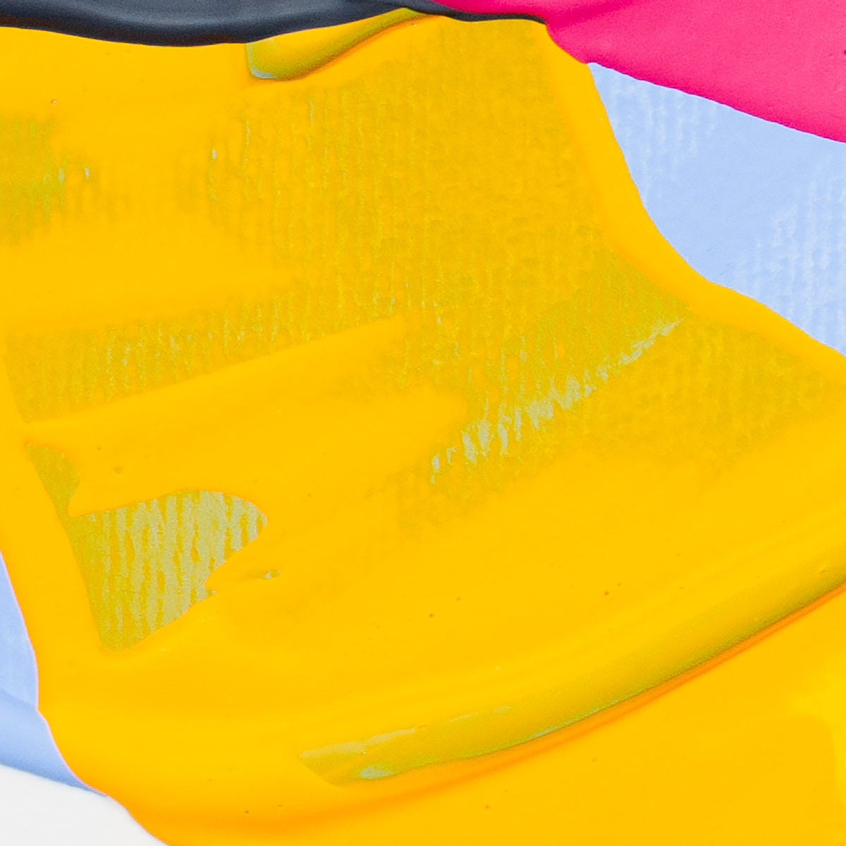 A close-up of a bright yellow textured material, likely a fabric or vinyl sheet, layered over other colorful sheets including pink, light blue, and white.