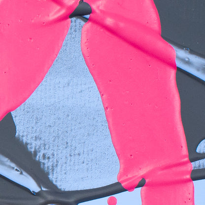 A close-up of bright hot pink paint with visible texture and drips over a light blue-gray textured surface and dark background.